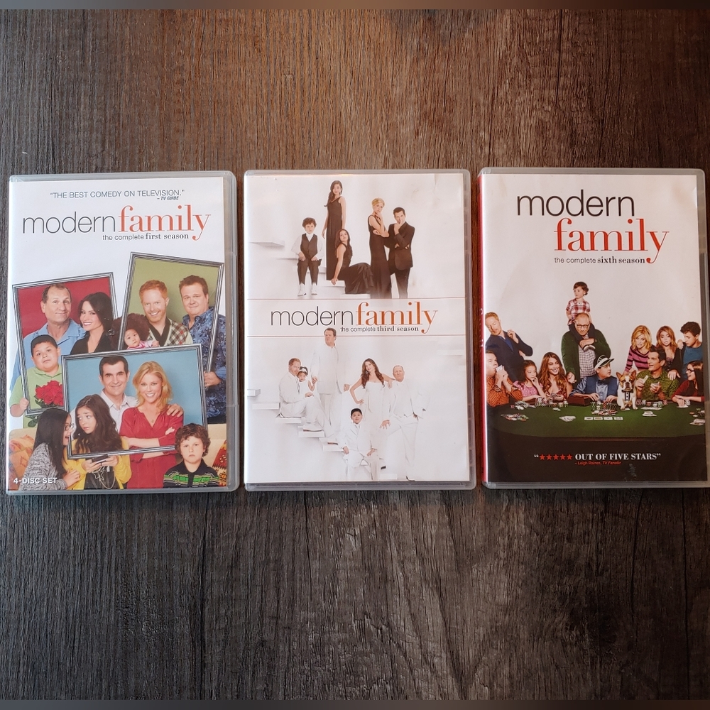 MODERN FAMILY TV- Series Seasons One, Three, and Six on 9 DVDs.